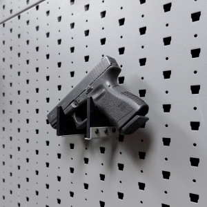 Horizontal pistol hanger mounted on GallowTech wall panel holding a handgun at a right angle