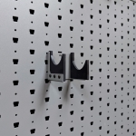 Hybrid Handgun Hanger Right empty, left-angle view mounted on Gallow wall panel