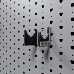 Hybrid Handgun Hanger Right empty, right-angle view mounted on Gallow wall panel