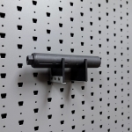 Medium horizontal suppressor hanger holding rifle suppressor, left angle